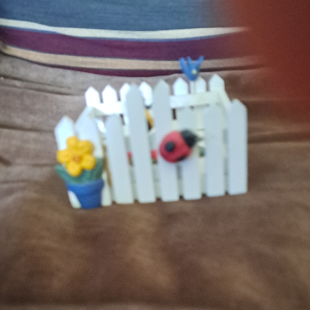 Charming White and Yellow Decorative Fence